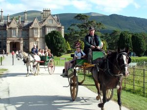 Jaunting cars in front of Muckross House